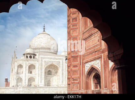 Taj Mahal tomb and mosque in the arch at blue sky in Agra, Uttar Pradesh, India Stock Photo