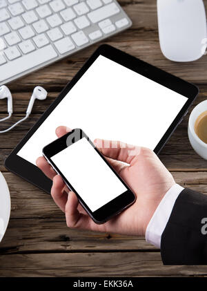 Workspace with coffee cup, tablet pc and note paper on old wooden table Stock Photo