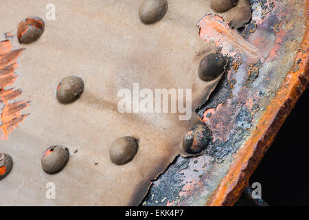 Detail shot of rusty steel beams with rivets from an old bridge. Stock Photo