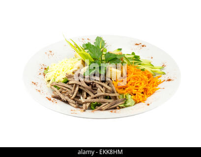 Salad with meat, carrots and croutons on an isolated background Stock Photo
