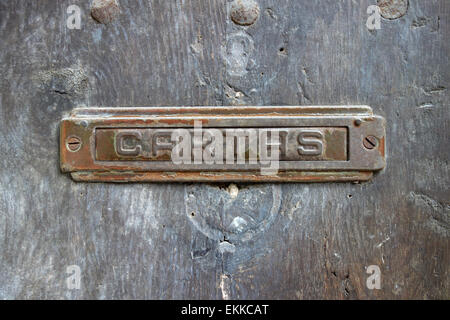 Traditional metal letter box on old wooden door in Gothic Quarter of Barcelona, Catalonia, Spain Stock Photo