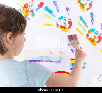 Beautiful little girl painting over white Stock Photo