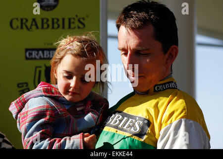Aintree Racecourse, Liverpool, UK. 11th Apr, 2015. Crabbies Grand National. Leighton Aspell with daughter Credit:  Action Plus Sports Images/Alamy Live News Stock Photo
