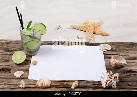 Fresh mojito cocktail with wooden table on the beach, summer background. Stock Photo