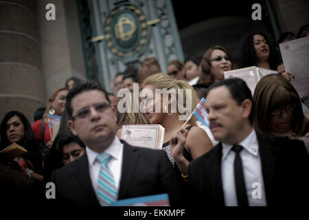 Mexico City, Mexico. 11th Apr, 2015. Paulo Herrera (C) reacts at the end of a handing over ceremony of birth certificates for transgendered people in the Legislative Assembly of Federal District (ALDF, for its acronym in Spanish), in Mexico City, capital of Mexico, on April 11, 2015. 31-year-old Paulo, a hair stylist living in Mexico City, received on Saturday the birth certificate that accredits him as Paula Herrera and female. Credit:  Pedro Mera/Xinhua/Alamy Live News Stock Photo