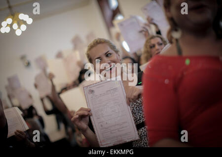 Mexico City, Mexico. 11th Apr, 2015. Paulo Herrera reacts at the end of a handing over ceremony of birth certificates for transgendered people in the Legislative Assembly of Federal District (ALDF, for its acronym in Spanish), in Mexico City, capital of Mexico, on April 11, 2015. 31-year-old Paulo, a hair stylist living in Mexico City, received on Saturday the birth certificate that accredits him as Paula Herrera and female. Credit:  Pedro Mera/Xinhua/Alamy Live News Stock Photo