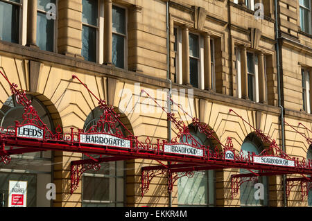 Newly restored wrought iron and leaded glass destination signs on the canopy of Victoria Station, Manchester, England, UK Stock Photo