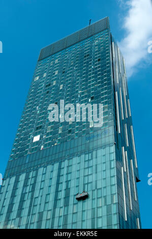 Window cleaners suspended in a cradle on the Beetham Tower, Deansgate, Manchester, England, UK Stock Photo