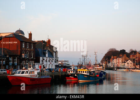 Fishing boats are moored at old Weymouth Harbour, in Dorset England April 2015 Stock Photo