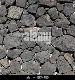 Stone wall made from volcanic rock in Lanzarote Stock Photo