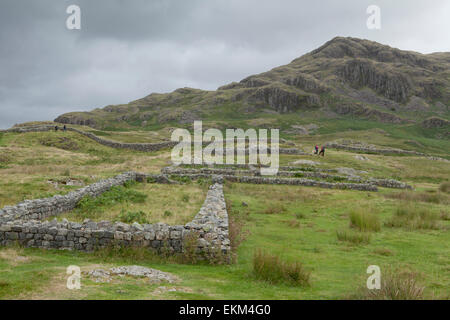 Visitors at Hardknott Roman Fort on the Hardknott Pass in the Lake District Stock Photo