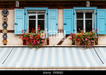 Facade of Maison Alsacienne de Biscuiterie, Obernai, Alsace, France with Kougelhopf tins and painted plates decorating facade Stock Photo