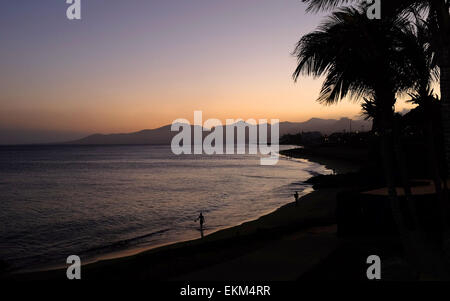 Lanzarote Puerto Del Carmen beach at sunset Stock Photo