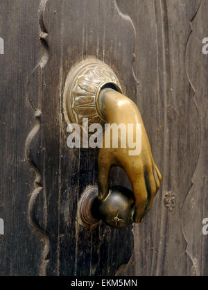 An unusual hand shaped door handle on a building in Palma, Majorca Stock Photo