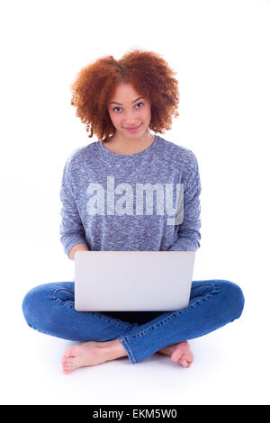 Black African American student girl using a laptop, over white background Stock Photo