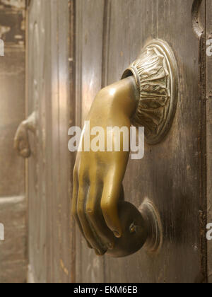 An unusual hand shaped door handle on a building in Palma, Majorca Stock Photo