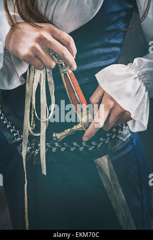 Medieval woman holding a dagger Stock Photo