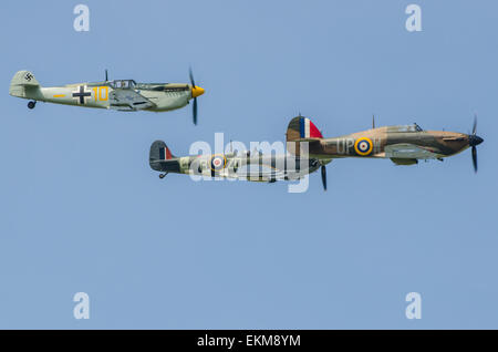 'Messershmitt Bf109' (actually a Buchon - see description) Spitfire and Hurricane in formation at an airshow. Second World War fighter planes. WWII Stock Photo