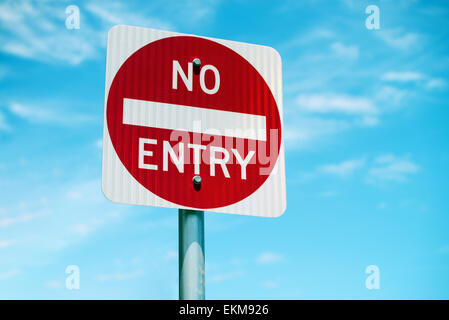 No Entry road sign with blue sky Stock Photo