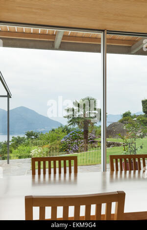 Interior, modern house, garden view from the dining table Stock Photo