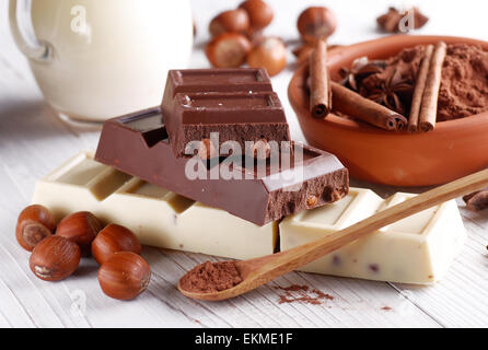 chocolate with hazelnuts and ingredients around Stock Photo