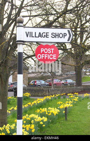 A sign points the way to a rural Post Office and village store at Baslow,Peak District National Park, Derbyshire - spring Stock Photo