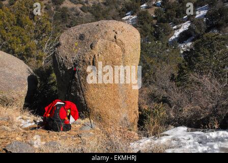 Day pack and tripod along trail Sandia Mountains of New Mexico - USA Stock Photo