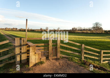 A stile on a countryside walk down the river Ouse in York, North Yorkshire, on a beautiful summer's evening. Stock Photo