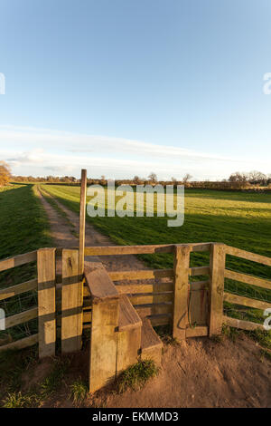 A stile on a countryside walk down the river Ouse in York, North Yorkshire, on a beautiful summer's evening. Stock Photo