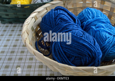 Blue yarn balls in basket Stock Photo