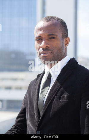 black businessman portrait on skyscrapers background Stock Photo