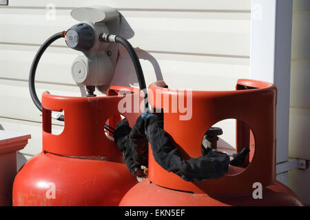 Caravan propane gas bottles in situ. Stock Photo