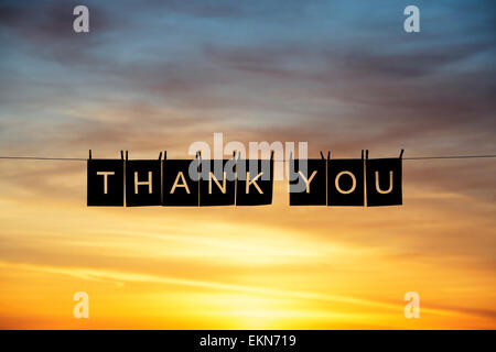Thank You silhouette against a colourful sunrise Stock Photo