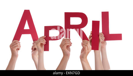 Many Caucasian People And Hands Holding Red Letters Or Characters Building The Isolated English Word April On White Background Stock Photo