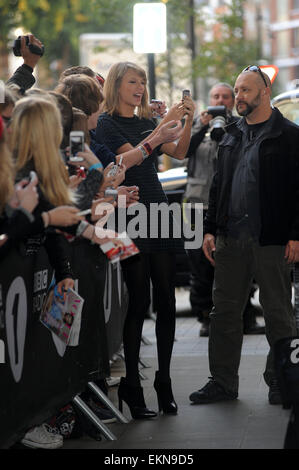 Taylor Swift is greeted by fans outside the BBC Radio 1 studios  Featuring: Taylor Swift Where: London, United Kingdom When: 09 Oct 2014 Stock Photo