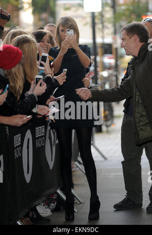 Taylor Swift is greeted by fans outside the BBC Radio 1 studios  Featuring: Taylor Swift Where: London, United Kingdom When: 09 Oct 2014 Stock Photo