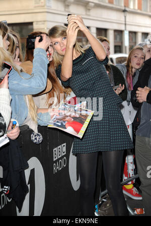 Taylor Swift is greeted by fans outside the BBC Radio 1 studios  Featuring: Taylor Swift Where: London, United Kingdom When: 09 Oct 2014 Stock Photo