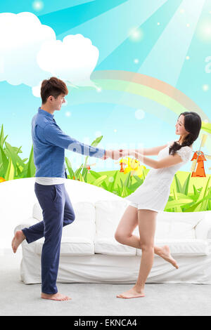 Happy young couple holding hands Stock Photo
