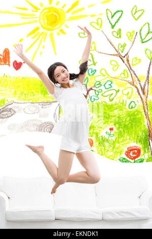 Happy young woman jumping Stock Photo