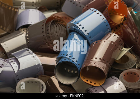 old technology wet process 35mm film reels different colored emulsion e6 transparency  black and white colour negative Stock Photo