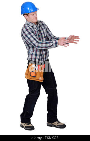 Laborer gesturing on white background Stock Photo