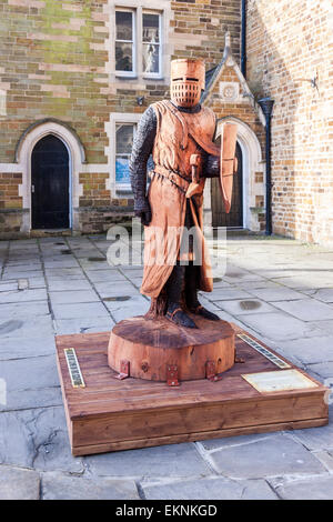 Northampton, UK. 13th April, 2015. 'A Knight's Trail' features six large-scale Medieval knight sculptures around the Town Centre, depicting the historical details of the English knights from the 13th, 14th and 15th centuries. All the sculptures of the knights have been carved from huge trunks by a group of three chainsaw artists, Daniel Cordell, Simon O'Rourke and Hue Thomas, who have exhibited around the world and won a number of prestigious commissions, including ones at Hyde Park, Kensington Gardens and more. Credit:  Keith J Smith./Alamy Live News Stock Photo