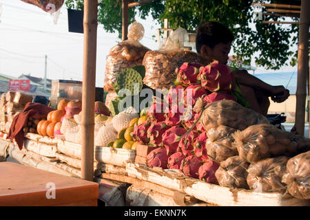 Dragon fruit & lotus fruit seeds are for sale as street food snacks in Kampong Cham, Cambodia. Stock Photo