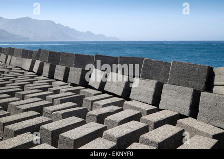 Hard engineering rectangular concrete blocks used to limit coastal erosion, Puerto de las Nieves, Gran Canaria, Spain Stock Photo