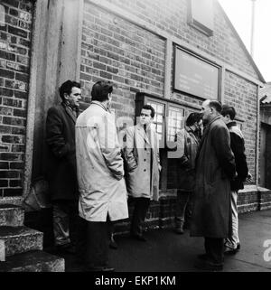 Unemployed and views of Liverpool, Merseyside, 30th November 1962. Unemployed workers outside the Ministry of Labour. Stock Photo