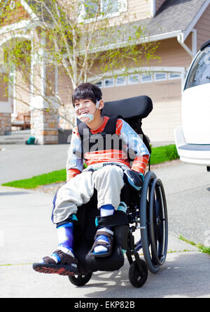 happy little disabled boy in wheelchair ekp82b