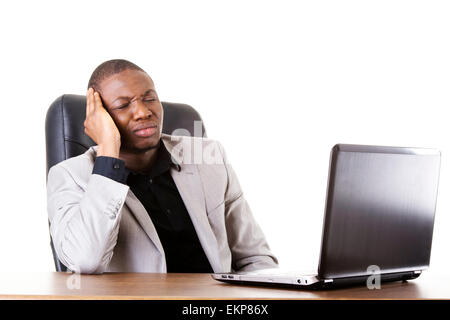 Stressed businessman working on laptop Stock Photo