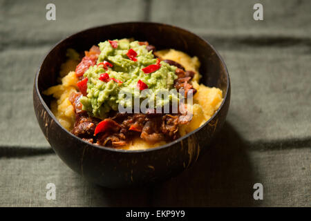 Vegetarian Chili with Guacamole and cheesy polenta Stock Photo