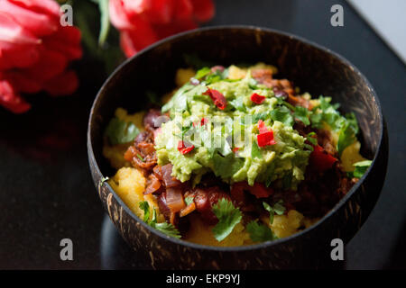 Vegetarian Chili with Guacamole and cheesy polenta Stock Photo