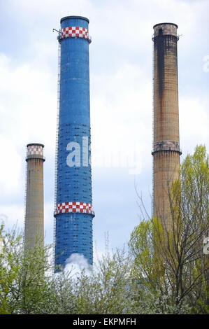Industrial shot with three smoke towers of a thermal power plant Stock Photo